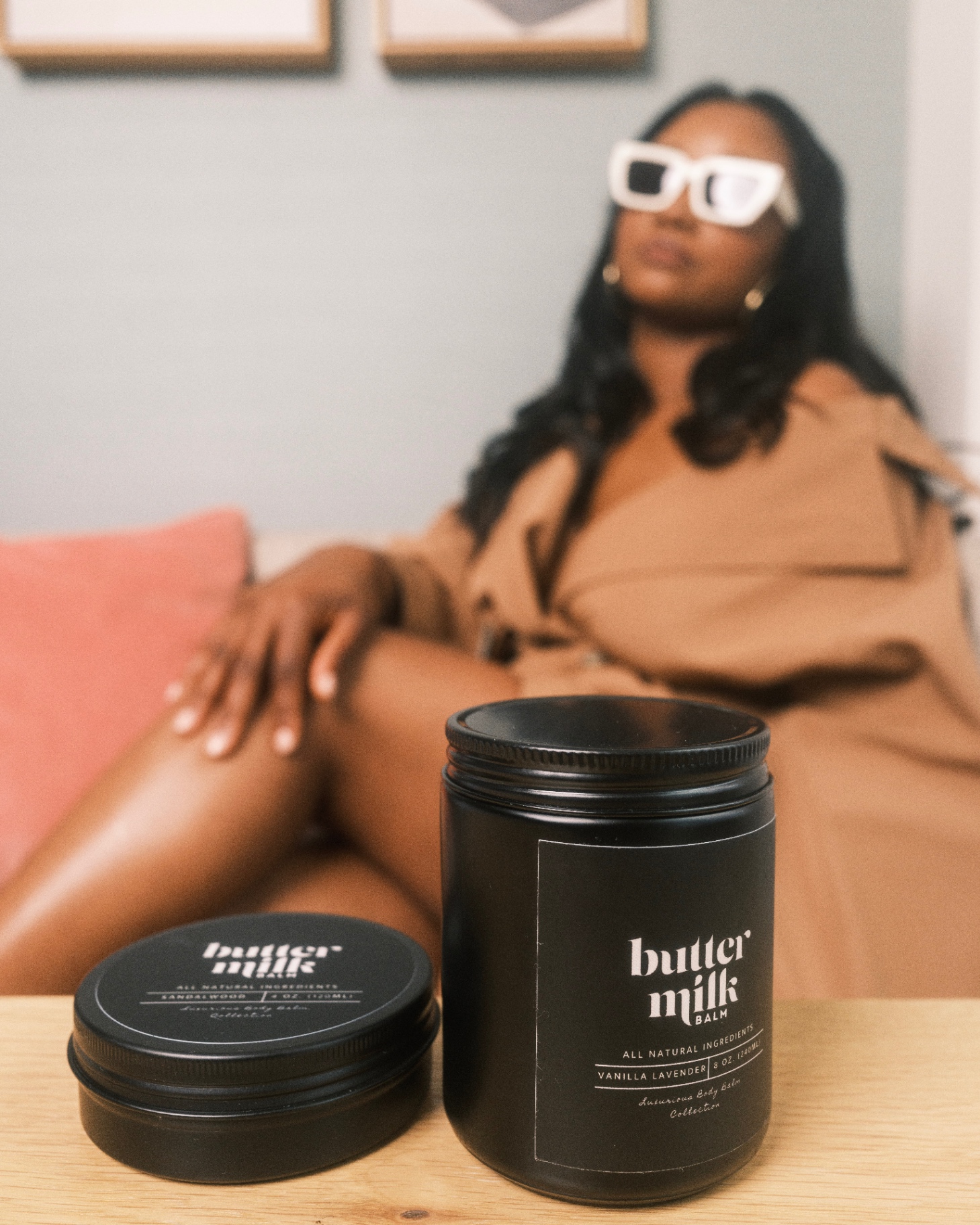 Buttermilk Balm product with model in sunglasses