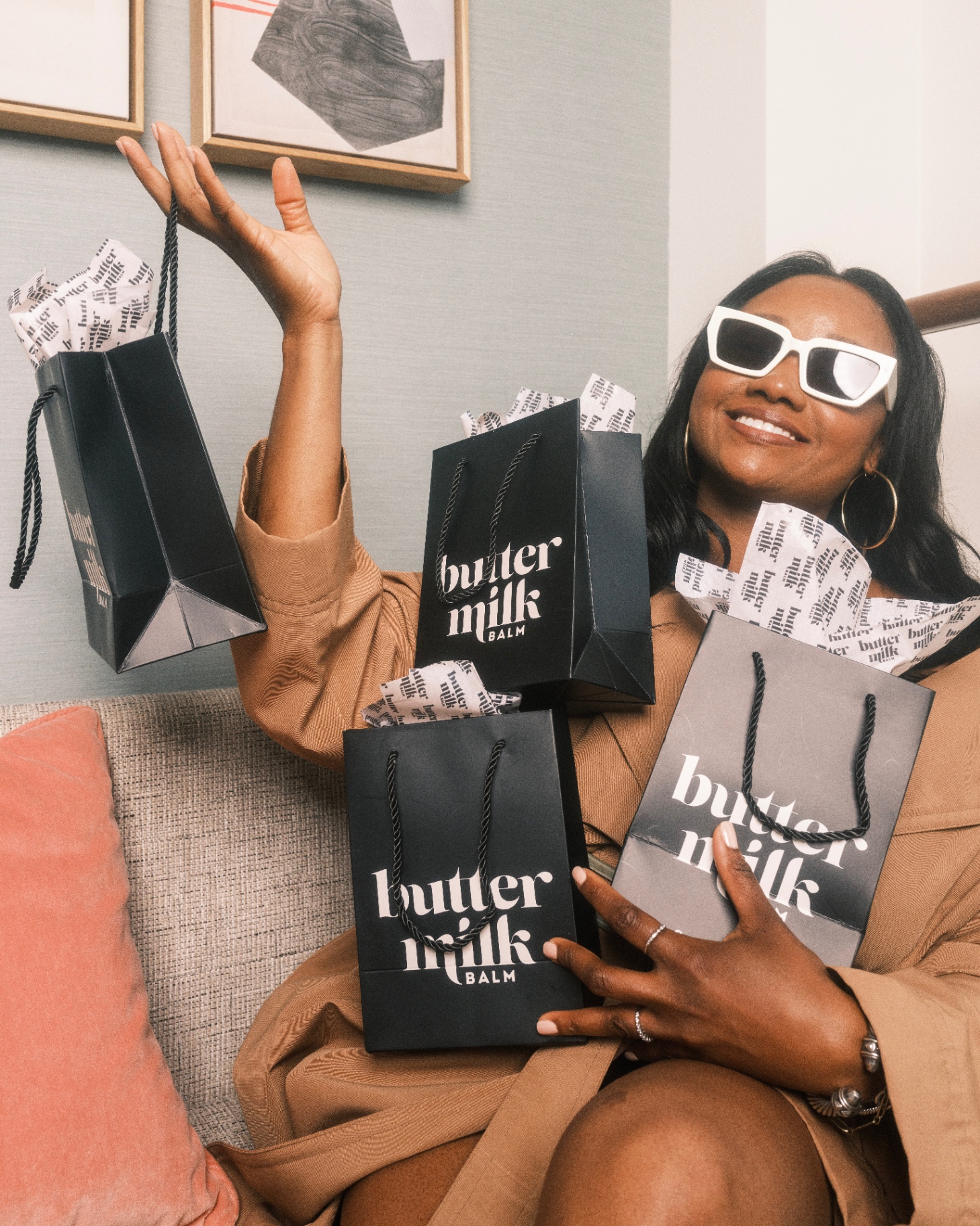 Model with Buttermilk Balm gift bags